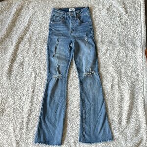 Distressed light wash flare jean